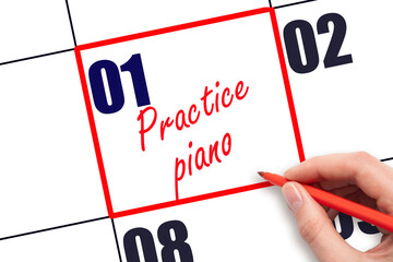 1 st day of the month. Hand writing Practice piano reminder and drawing red frame on calendar with...