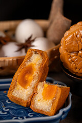 Close-up of traditional Vietnamese mooncake with salted egg yolk filling
