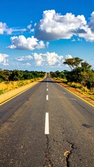 Empty road stretching into a bright sky