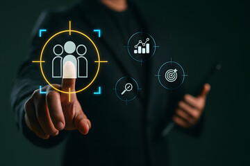 Businessman touching target audience icon with digital marketing and analytics symbols, representing customer targeting, market segmentation, CRM, and data-driven strategy.