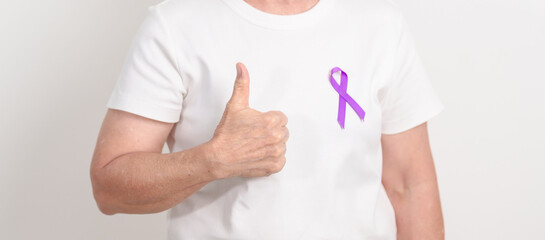 Elderly with Purple Ribbon for Violence, Pancreatic, Esophageal, Testicular cancer, Alzheimer, Epilepsy, Lupus, Crohn, Thyroid,  Sarcoidosis and Fibromyalgia. Awareness month and World cancer day