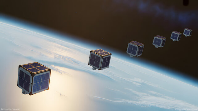 Satellite cubes in space orbiting earth in a row formation