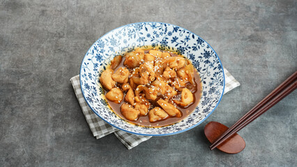 Teriyaki Chicken with onion, soy sauce, butter and sesame seeds