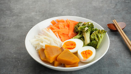 Healthy Salad Bowl, mix vegetables carrots, jicama, pumpkin, broccoli and egg