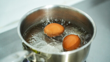Boiling eggs with saucepan stainless steel for breakfast