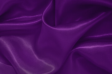 Dark purple fabric texture background, detail of silk or linen pattern.
