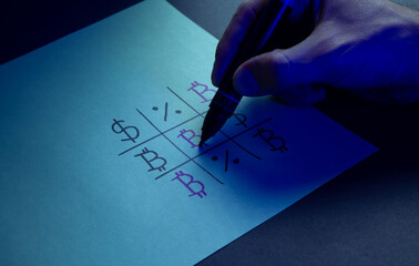 Choosing bitcoin investment. Tic-tac-toe game with Bitcoin and dollar symbols under blue light. Cryptocurrency versus traditional finance