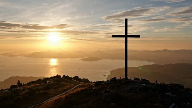 an ethereal image of a majestic cross on a mountain at sunrisestands atop bathed in warm