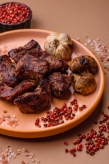 Beef, grilled meat in pieces, or kebab with sauce and vegetables. Beef in pieces
