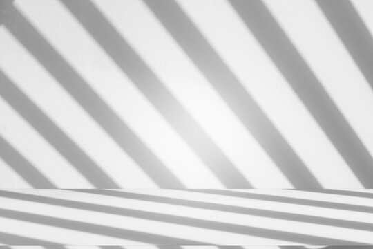 Wall interior background, studio and backdrops show products.with shadow from window color white and grey. background for text insertion and presentation product	
