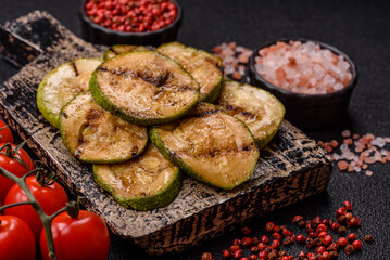 Grilled green zucchini slices, vegetarian food. Green barbecue zucchini