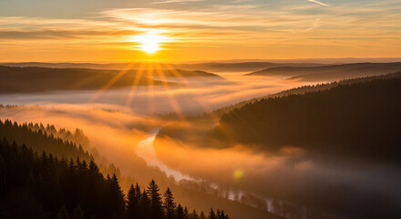 Golden sunrise over the misty valley with fogcovered hills and forests, creating a serene and picturesque landscape with warm light and soft shadows