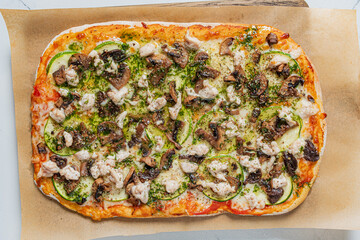 Freshly baked flatbread pizza features vibrant toppings, inviting aromas fill the cozy space