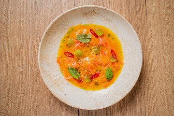 Fresh salmon ceviche boasts vibrant colors and flavors, highlighting culinary creativity