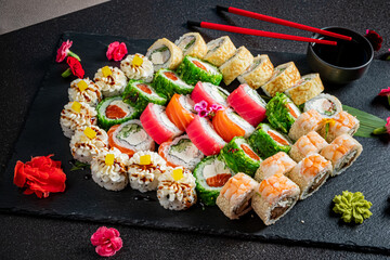 Vibrant sushi assortment features diverse flavors and colorful garnishes on a stylish platter