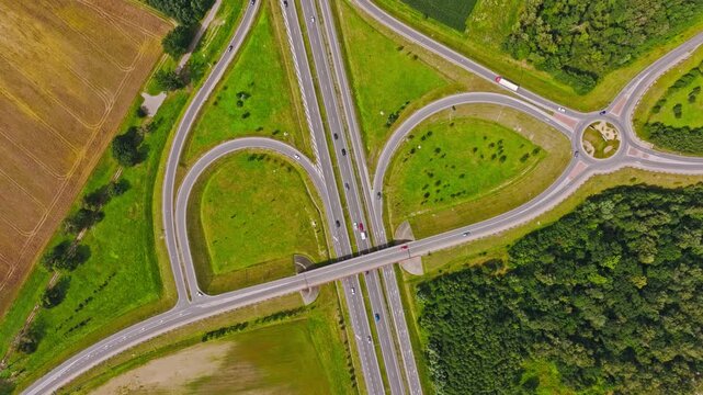 Drone rotate clockwise above highway junction, Paslek North Poland showing roads