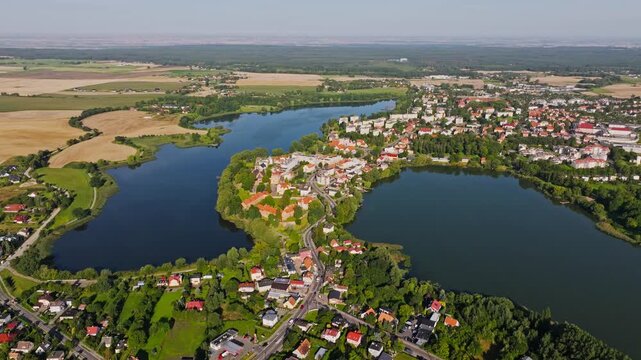 Aerial establishing shot of Sztum Poland, city streets meet surrounding forest