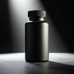 black plastic bottle on black background
