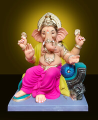 Hindu God Ganesha on colourful background, Ganesha Idol. Ganesh festival.