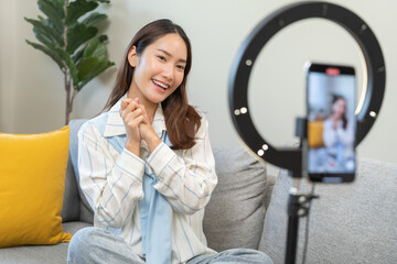 Influencer live internet, happy vlog asian young woman blogger using smart phone talking on video...