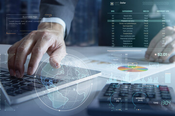 A close-up of a business executive or analyst in an office setting, utilizing a laptop computer to analyze a business plan and return on investment.