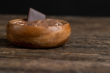 sweet yogurt in a bowl with chocolate , chocolate pieces in milk yogurt, dessert with chocolate...