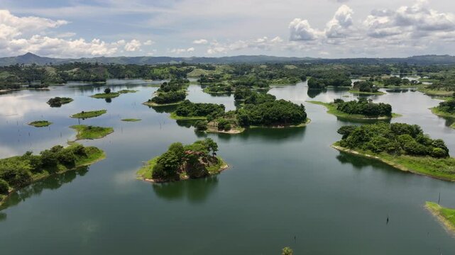left 360&deg; panning across Bayano Lake - with many small islands, green Jungle and Rainforest landscape all around - located near Akua Yala in Babita de Perro, Panama - 4k aerial video footage