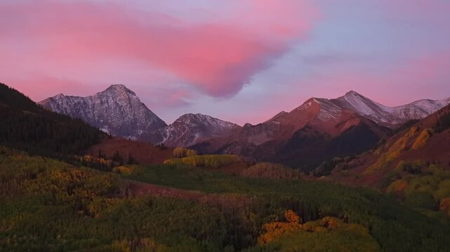 Elk Range Capitol Peak leaf peeping Fall Autumn Aspen Snowmass Colorado Rocky Mountains Mount Snowmass first light early morning sunrise pink cloud hues yellow golden White River Aspen Trees zoom in