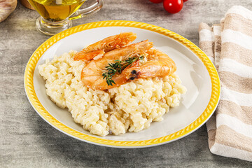 Italian risotto with prawn served thyme