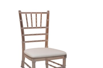 Fototapeta premium This elegant chiavari chair features a clear design with white padded seat. It's perfect for luxurious weddings and formal events.