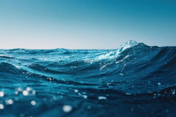 Serene ocean waves gently lapping against a deep blue backdrop at sunset, creating a tranquil atmosphere and inviting reflection on the beauty of nature