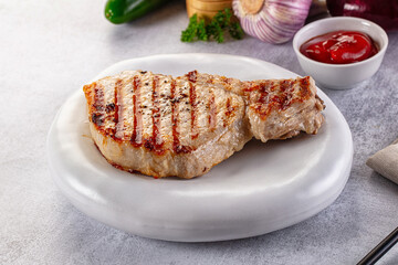 Tasty hot grilled bone steak served sauce