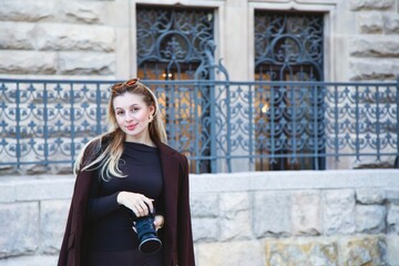 Beautiful woman photographer in front of a fairy-tale historic castle in Poland ©  Tsvyk L.
