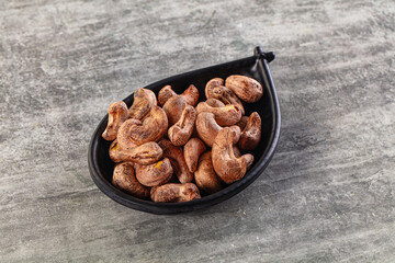 Unpeeled cashew nuts in the bowl