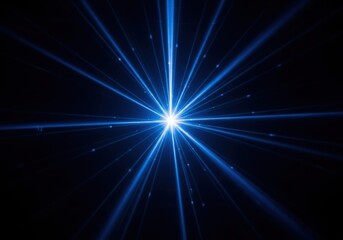 Fototapeta premium Bright blue starburst radiating light against a dark background