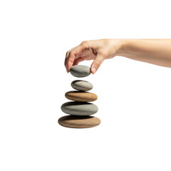 Hand Stacking Balance Stones. Zen Cairn for Harmony Stability and Mindfulness on Black Background.