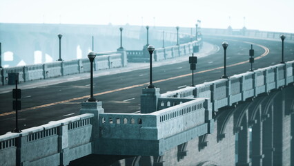 A winding bridge stretches into the fog, surrounded by a serene atmosphere. The road is empty, and street lamps stand sentinel, creating an enchanting and tranquil scene perfect for reflection.