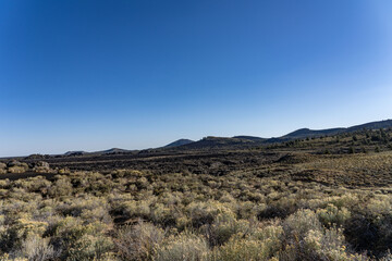 Lava flows and cinder cones. Craters of the Moon National Monument. U.S. Highway 20 (US 20)  / U.S. Highway 26 (US 26) , Butte County, Idaho. Snake River Plain. 
