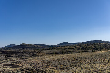Lava flows and cinder cones. Craters of the Moon National Monument. U.S. Highway 20 (US 20)  / U.S. Highway 26 (US 26) , Butte County, Idaho. Snake River Plain. 
