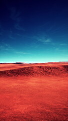 Expansive red desert stretches out, meeting a clear blue sky. Distant mountains rise gently, creating a serene and captivating natural scene. The colors blend harmoniously, evoking peacefulness.