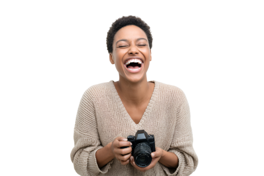 Cheerful female photographer with camera expresses pure happiness and delight with her creative art in portrait photography studio joyful expression of professional success