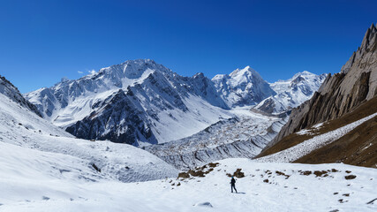 Lone Hiker Surveys Vast Snow