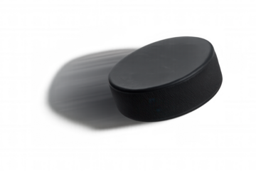 Hockey puck in motion moving fast with speed blur, playing ice hockey sport, transparent background