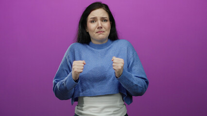 Woman in blue sweater showing various emotions on pink background conveying diverse feelings like...