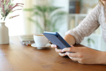 Woman hands holding ebook reading digital book