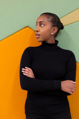 Confident woman against colorful background