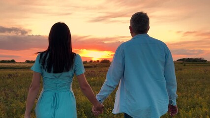man woman holding hands walking towards sunset, people love hug sunset, happy family, Moments of love, Heartfelt connection, Silk sky romance, Sunset stroll, End of day walk, Joy in nature, Intimate