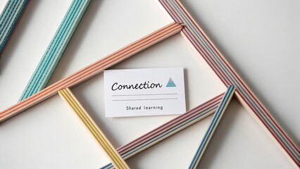 Paper strips forming geometric design around connection card