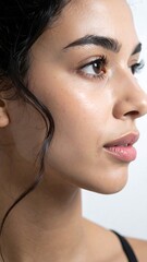 Profile portrait of a woman with glowing skin