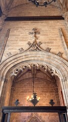 Architectural Elegance: A soaring arch of a historical building with detailed stonework, the intricate design showcases the art of architecture. Capturing the building’s majesty.
